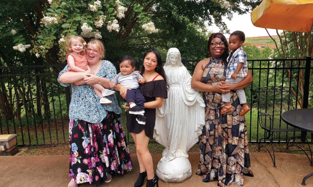 St. Clare's Home moms who have gone on to support themselves still visit the home. At the far right is Tamara with her son King, the first baby born to the home.