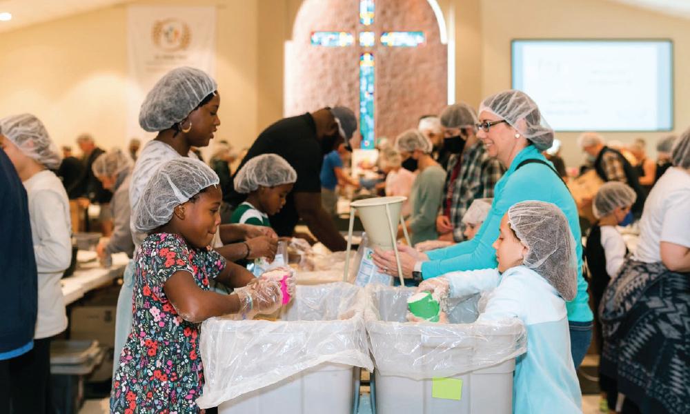 St. Philip Neri Community Serves Locals and Haiti With Meal Packing Event