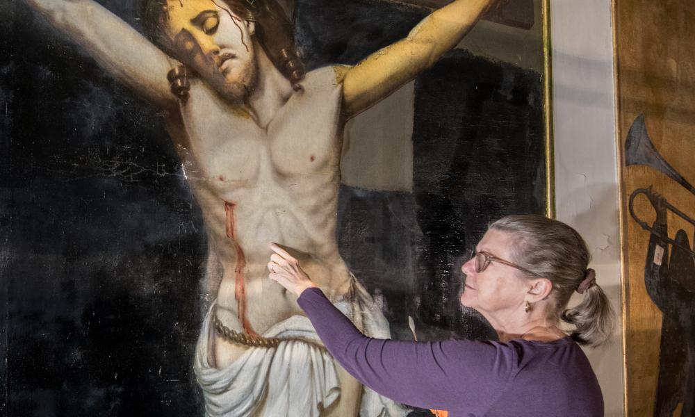 Catherine Rodgers works on art restoration at St. Mary