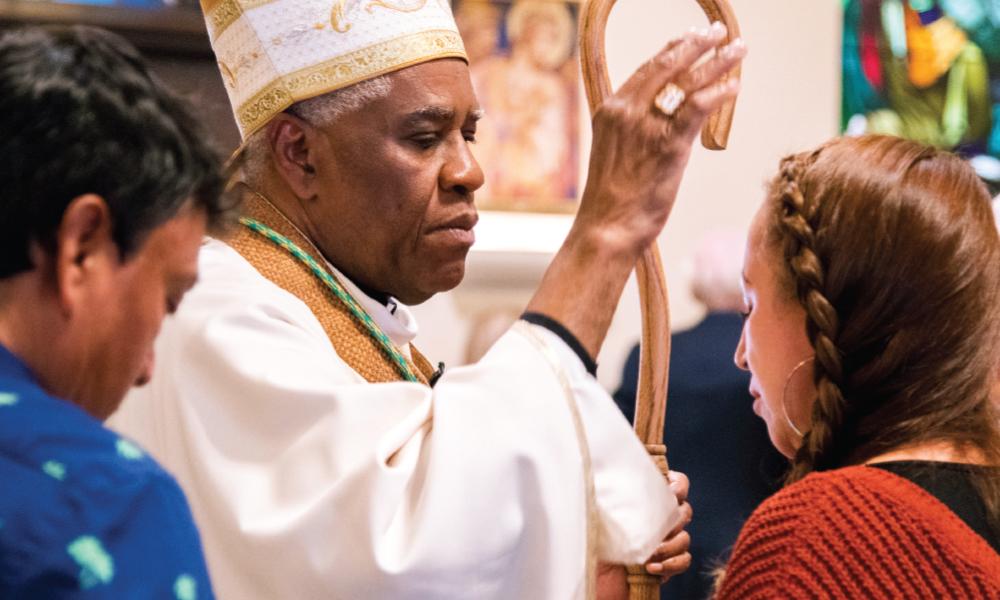 BIshop Jacques Fabre-Jeune blessing a couple