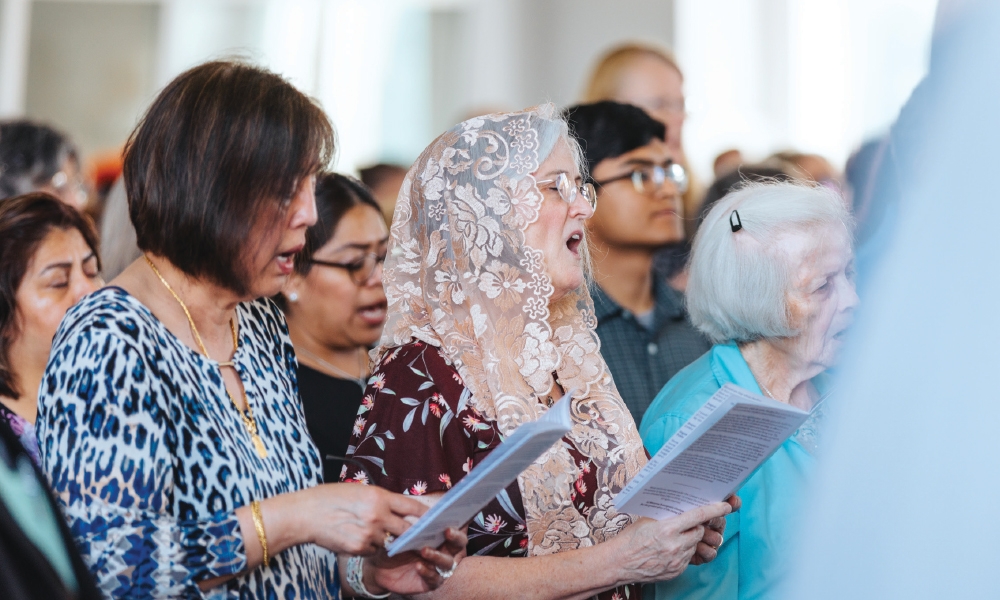 Parishioners singing during Mass