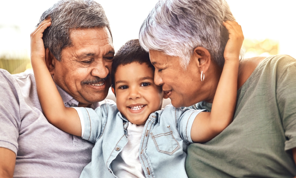 Child embracing grandparents