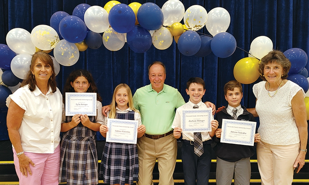 Frank Perciavalle, center, and Pamela Conover Perciavalle, far right, presented the Perciavalle Family Scholarships at St. Francis by the Sea School’s academic awards ceremony May 22. Also pictured are, at left, Kris Watson, fourth grade teacher, and her students with the highest or most improved Math MAP scores