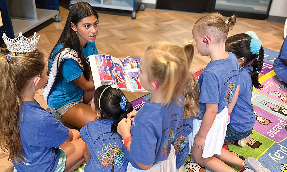 Kallyn Long reading to a group of children