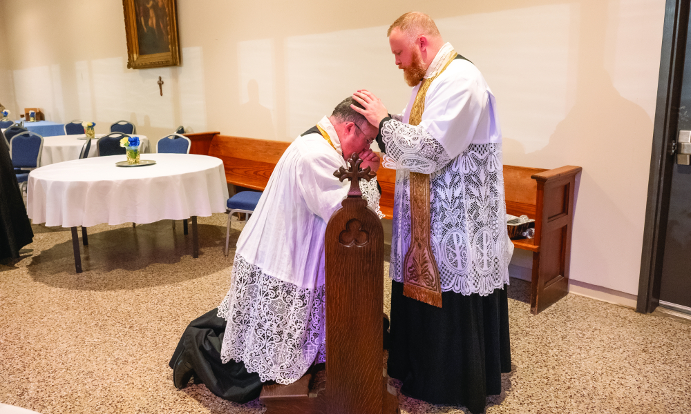 Father Paul Sizemore blessing Father Michael Tracy