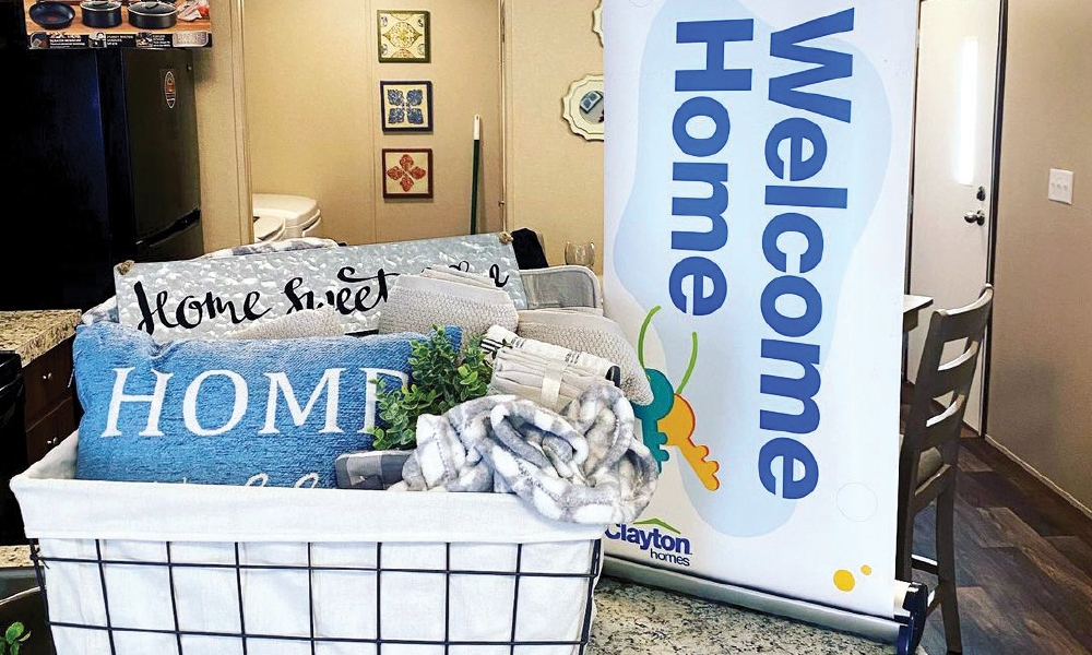Image of a welcome home banner and basket in a living room