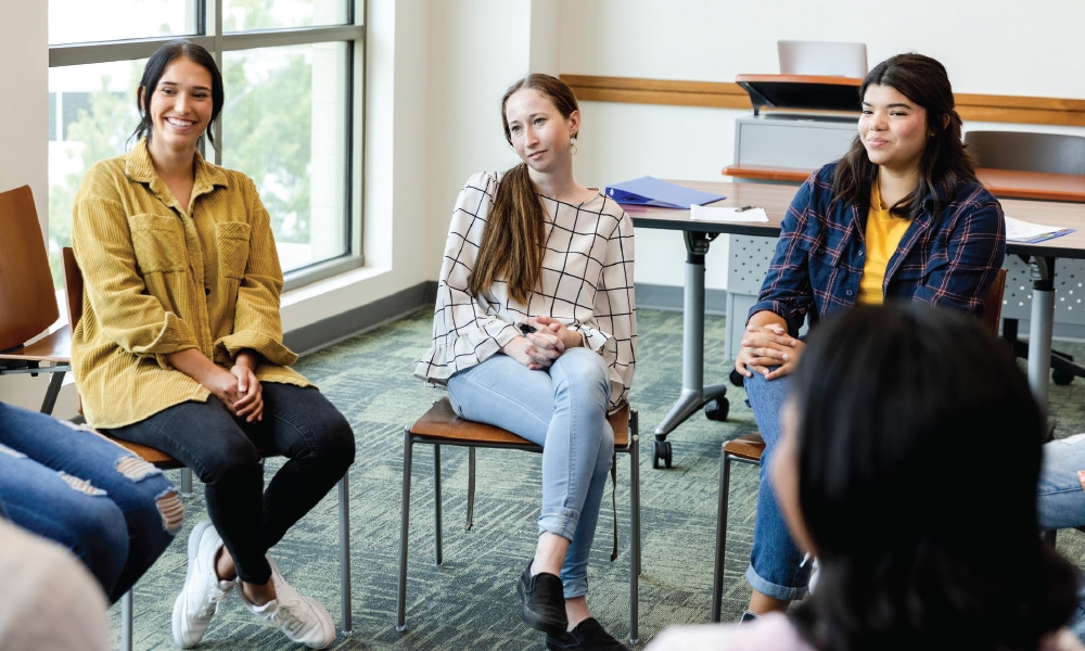 Women sitting in a circle and talking