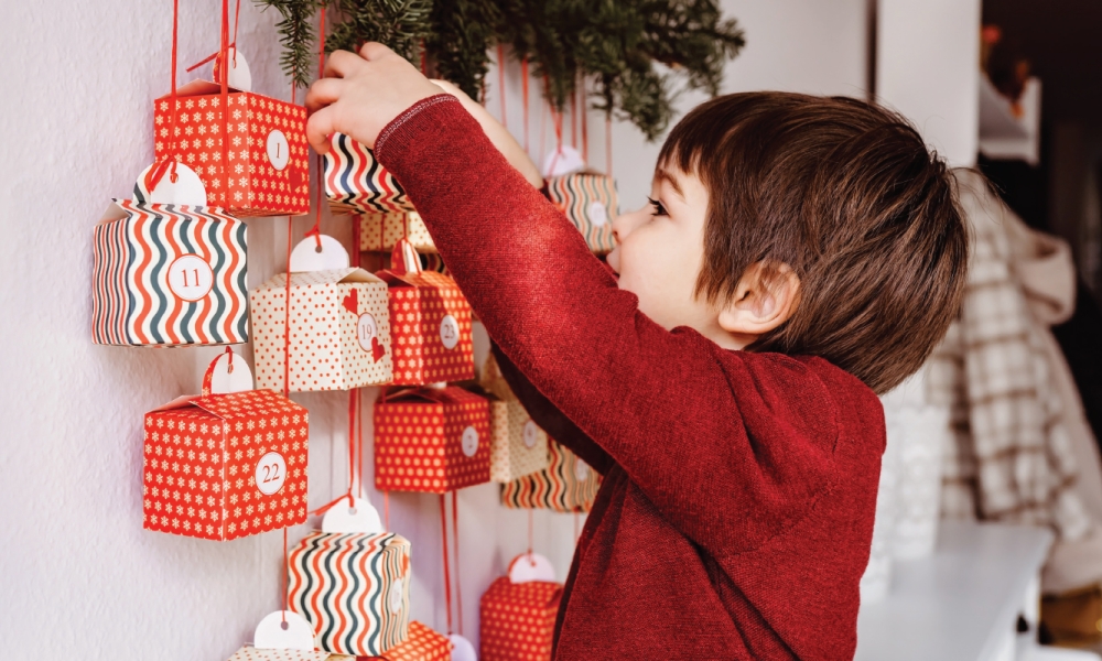 Child peeking into an Advent calendar
