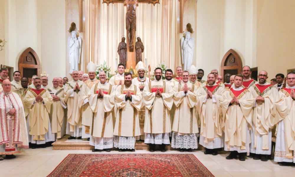 Bishop Fabre-Jeune with newly ordained deacons