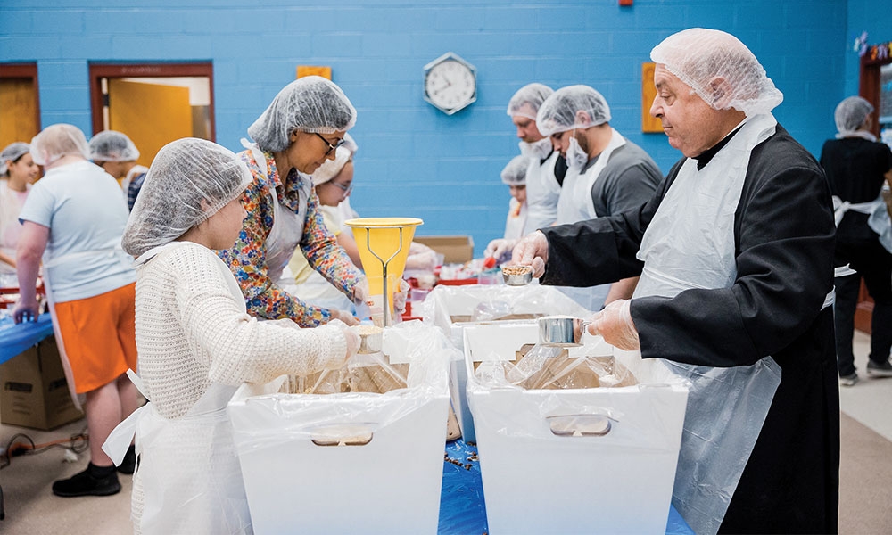 Volunteers packaging food