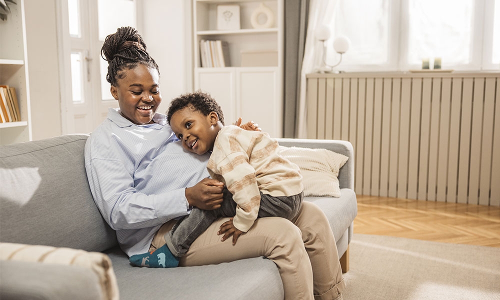 Child siting on mother's lap