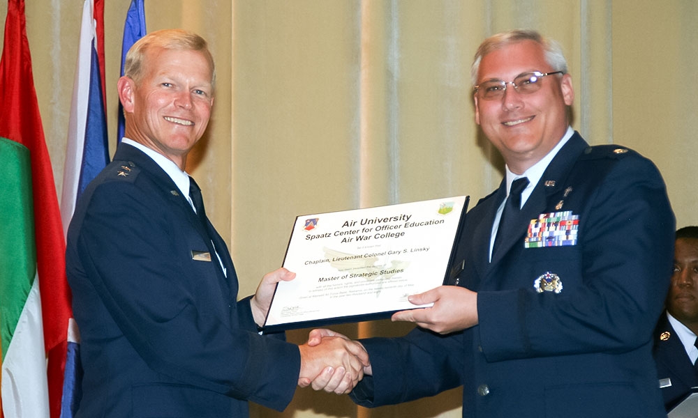 Chaplain Lt. Colonel Gary Linsky receiving his Master of Strategic Studies