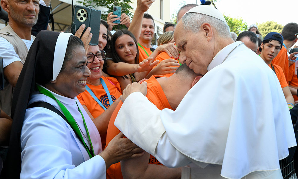 Pope Leo embracing a man at the Basilica of St. Mary